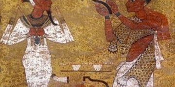 Un Kongo avec sa peau de léopard en Egypte antique devant Osiris